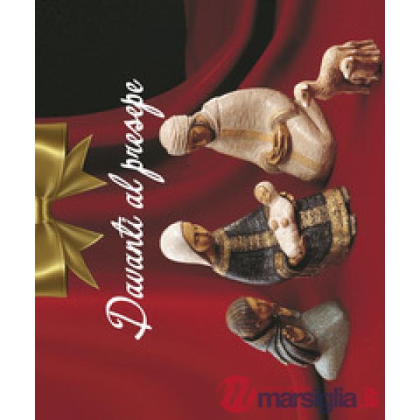 Davanti al presepe